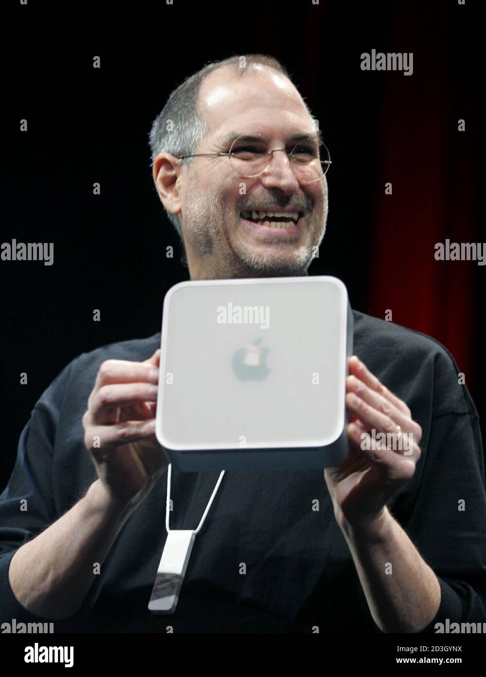 Apple Ceo Steve Jobs Holds Up Apple S New Mini Mac Computer Which He Introduced At The Macworld Conference In San Francisco January 11 05 The Mini Mac Is A Very Small 499