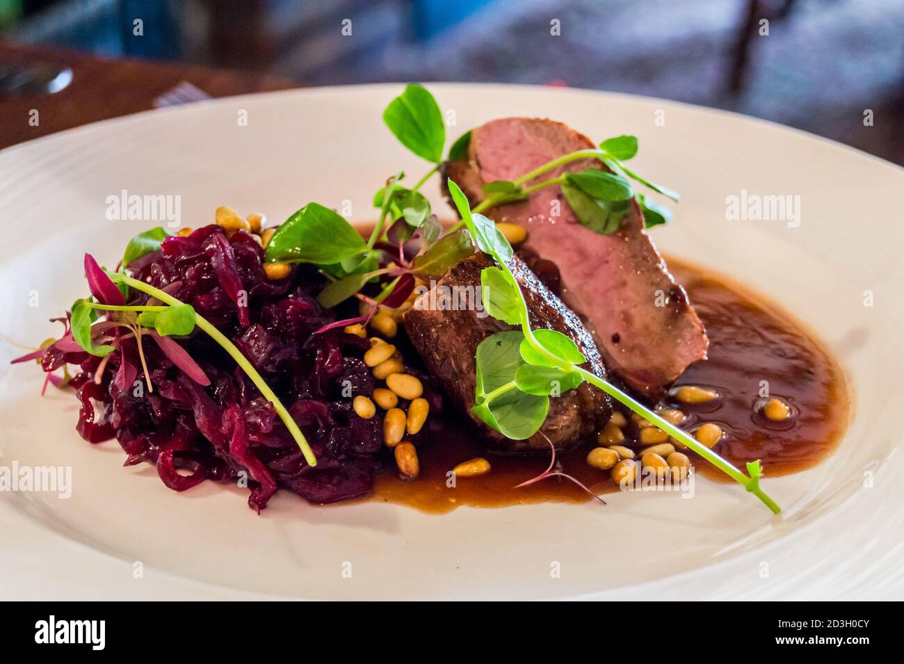 Barbary duck steak with red cabbage, pine nuts and watercress, The Bull gastropub, Theydon Bois, Essex, England Stock Photo