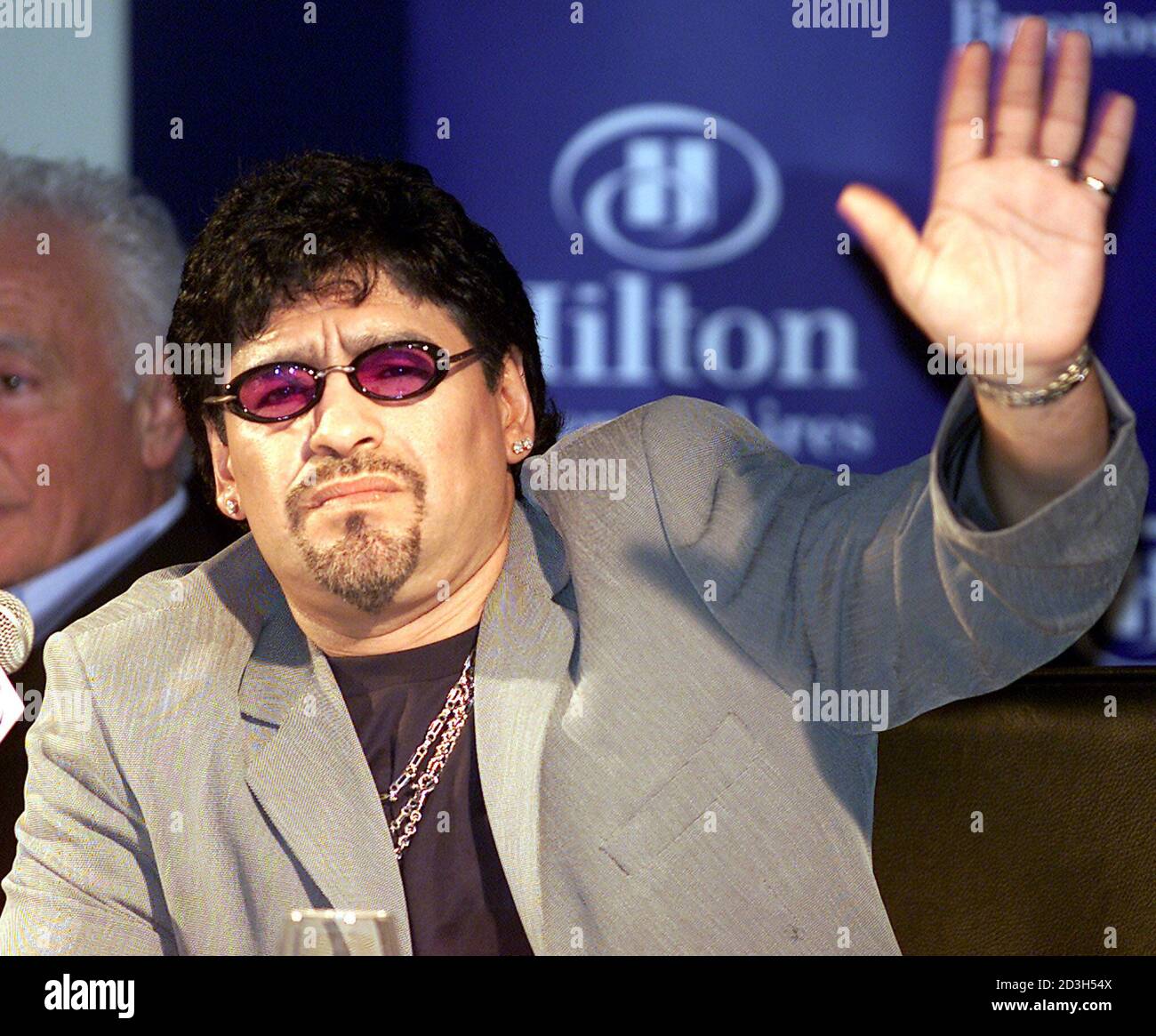 Argentine soccer legend Diego Maradona waves to photographers during a  press conference in Buenos Aires, November 6, 2001. Maradona gave details  of his November 10 testimonial game. Maradona, who is based in
