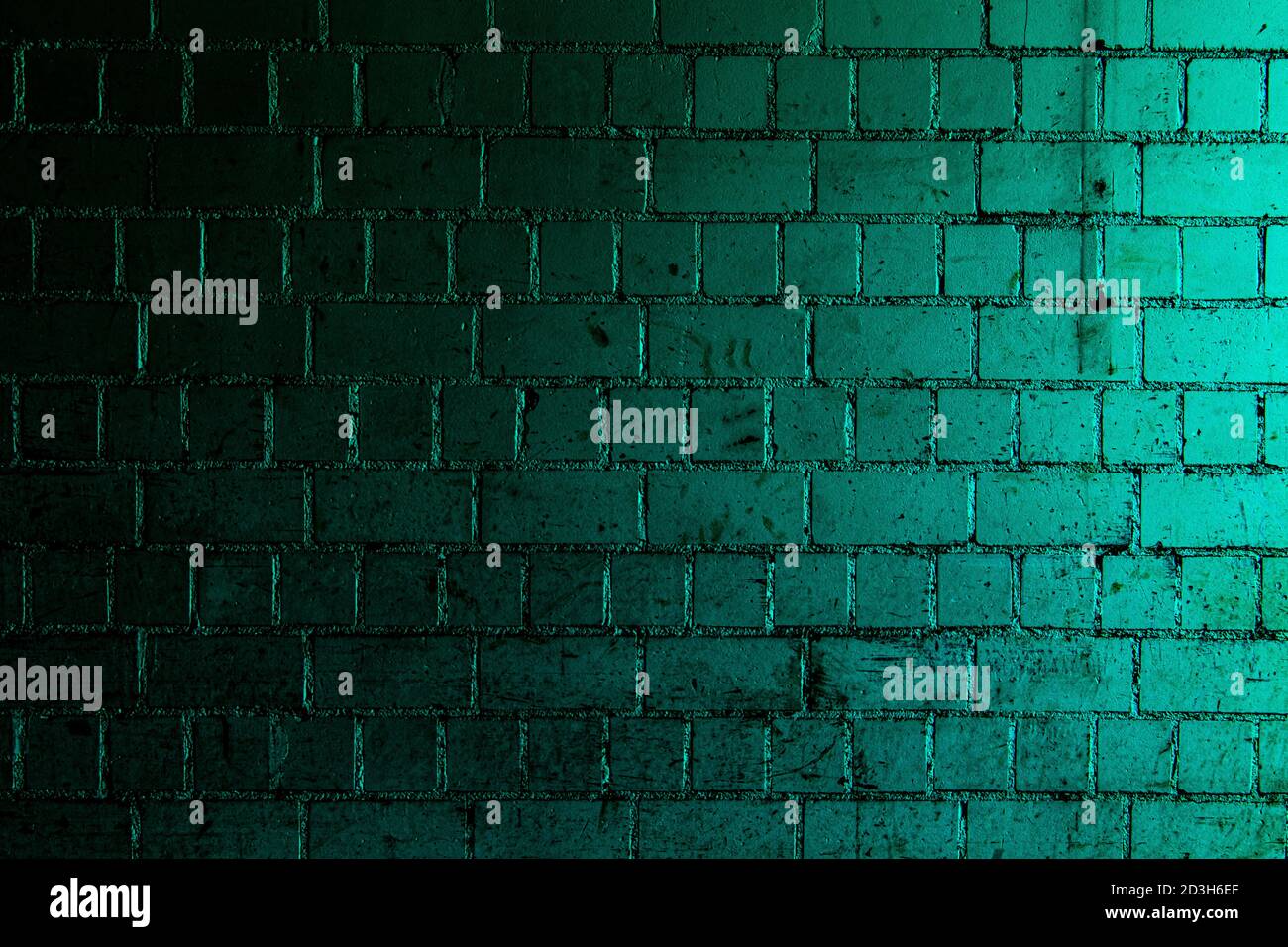 Petrol brick wall background with shades of light and dark teal Stock Photo