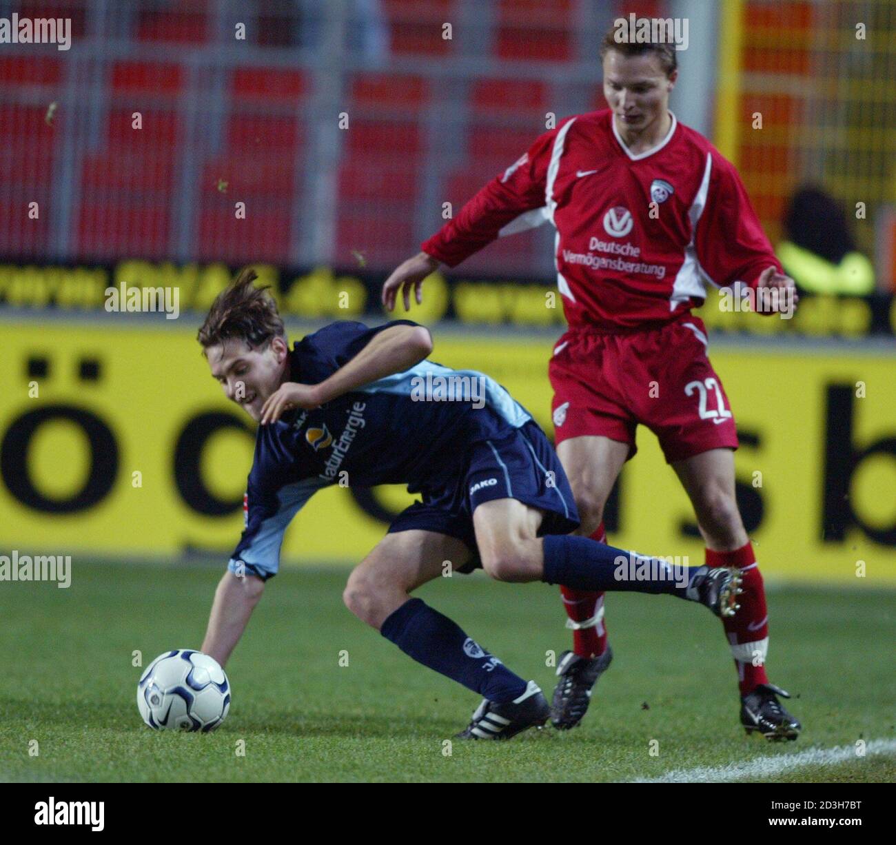 TIMM OF KAISERSLAUTERN CHALLENGES MAENNER OF SC FREIBURG DURING THEIR GERMAN SOCCER CUP MATCH IN KAISERSLAUTERN. Stock Photo