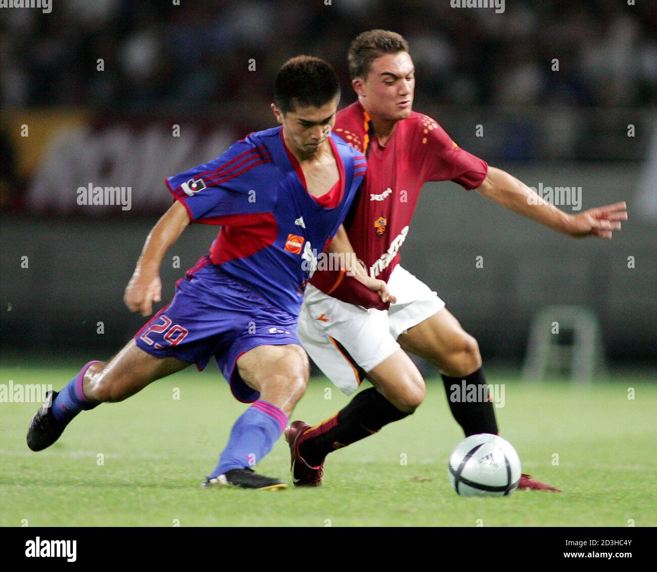 Daniele Corvia From Italian Club As Rome Fights For The Ball With Kazuya Maeda From The Japanese Club Fc Tokyo During A Friendly Soccer Match In Tokyo Daniele Corvia R From Italian