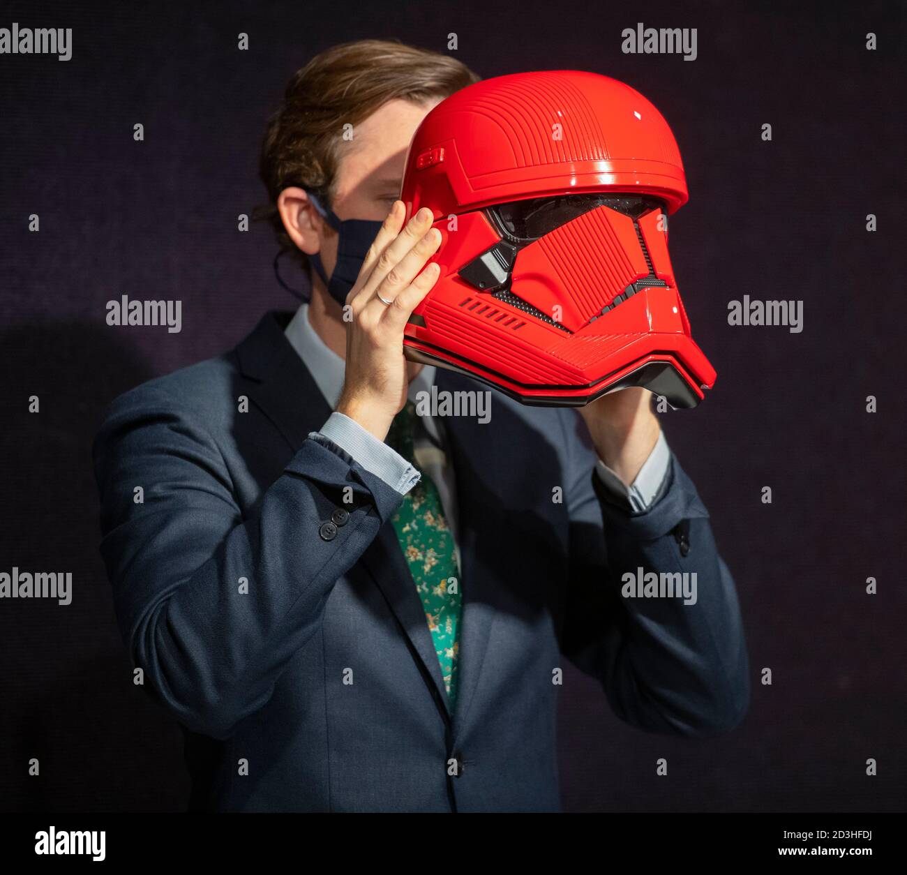 Bonhams, Knightsbridge, London, UK. 8 October 2020. Bonhams’ Entertainment Memorabilia sale includes a rare, screen-used Sith Trooper Helmet from Star Wars: The Rise Of Skywalker (2019), kindly donated to BAFTA’s year-round charitable activity by Lucasfilm. The helmet was created by BAFTA award-winning costume designer Michael Kaplan in a striking red colour, distinguishing the new stormtroopers from the classic, white-armoured forces beloved by previous generations. It has an estimate of £20,000-30,000. Credit: Malcolm Park/Alamy Stock Photo