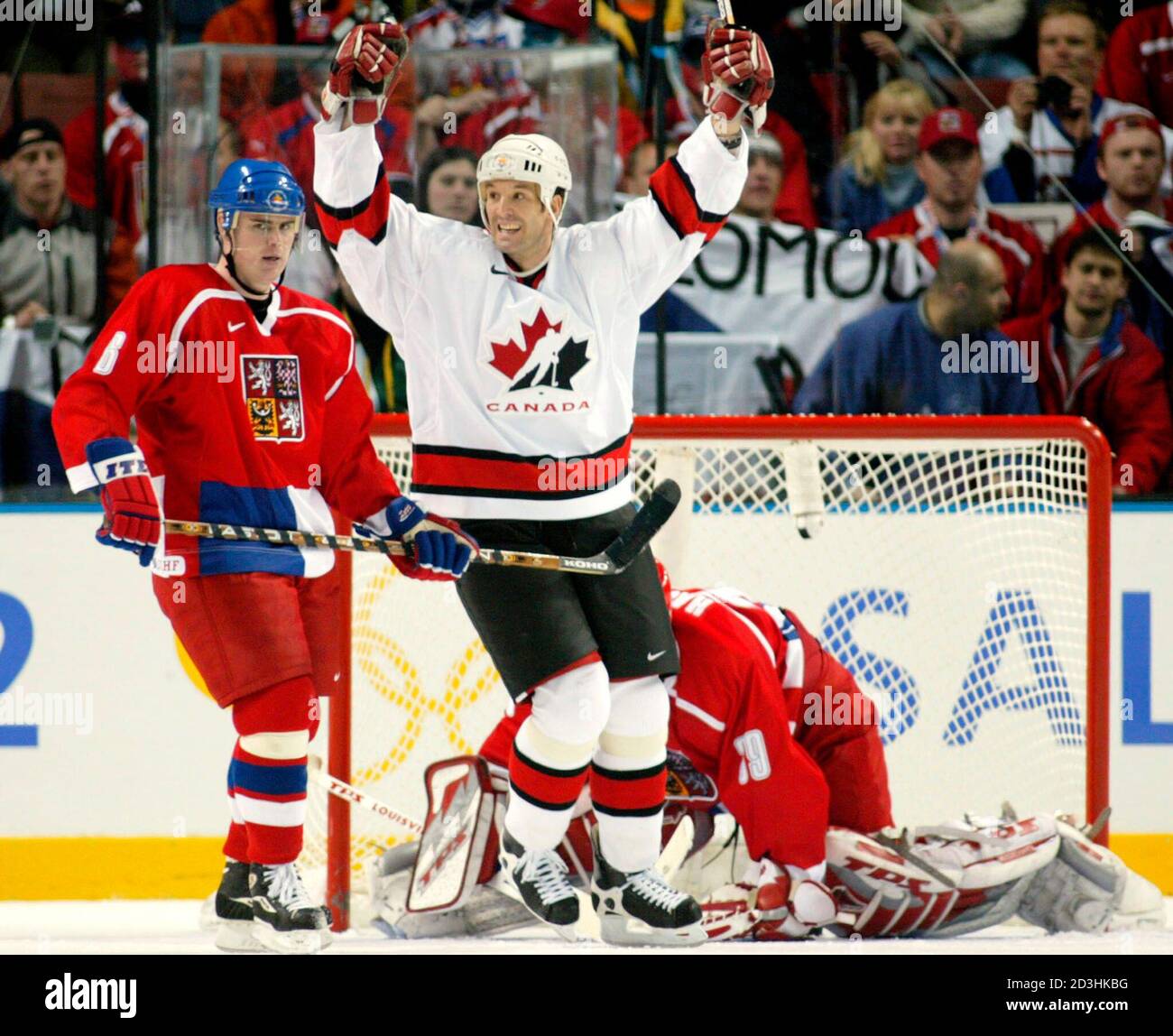 Forward Brendan Shanahan of Canada celebrates teammate Joe Nieuwendyk's game  tying goal getting past Czech goaltender Dominik Hasek (Rear) as Czech  defenseman Jaroslav Spacek (L) looks on late in the third period