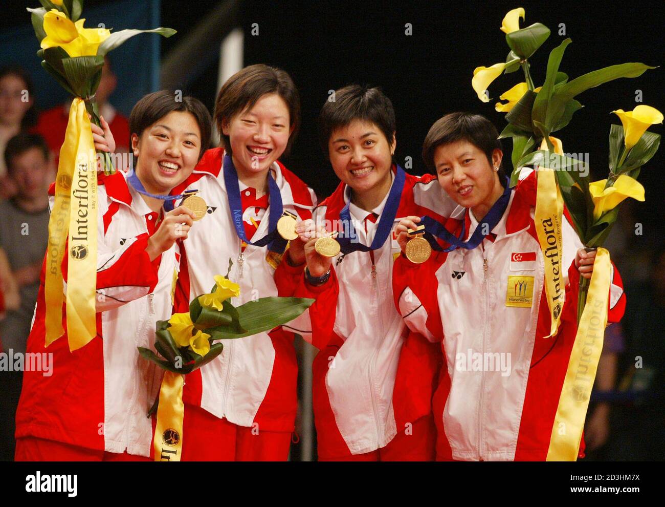 THE SINGAPORE WOMEN'S TABLE TENNIS TEAM CELEBRATE GOLD MEDAL VICTORY AT THE 2002  COMMONWEALTH GAMES IN MANCHESTER. Members of the Singapore women's table  tennis team (L-R) Xue Ling Zhang, Jia Wei Li,