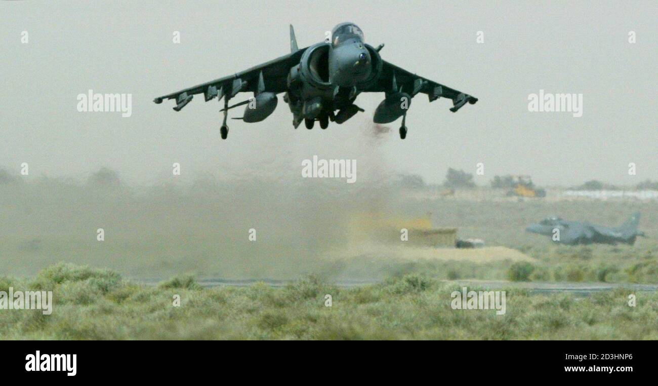 A Royal Air Force Harrier GR7 ground attack jet of the 2nd/4th Wing RAF Cottesmore lifts off from a base in the Gulf, on its way to a training mission March 4, 2003. Britain's Chancellor of the Exchequer Gordon Brown pledged on Tuesday that the government would find all the necessary money to fund a possible war with Iraq and the battle against international terrorism. The British finance minister has already set aside 1.75 billion pounds ($2.76 billion) to cover the cost of any conflict, which could start within weeks. REUTERS/Chris Helgren Stock Photo