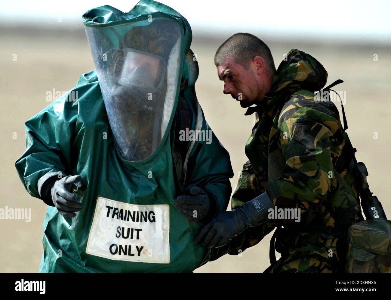 BRITISH ARMY ENGINEER STRUGGLES TO WEAR A RUBBER CHEMICAL SUIT WHILE 