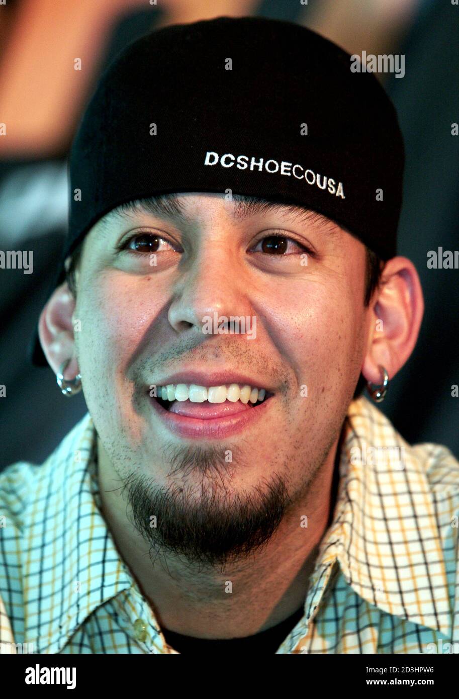 Linkin Park MC Mike Shinoda smiles during a news conference at the Boost  Mobile Pro of Skateboarding contest at the Hard Rock Hotel & Casino in Las  Vegas, Nevada, June 27, 2003.