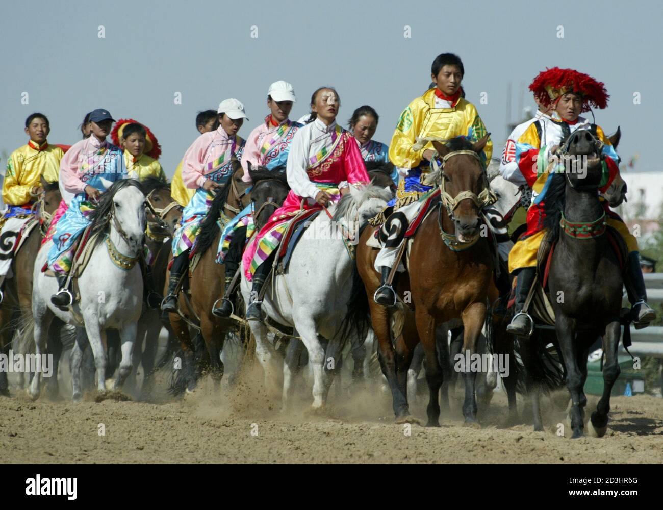 Chinese Ethinic Minorities Wearing Traditional Attires Parade On Horses During The 7th National Ethnic Sports Meeting In Sha Hu Sand Lake Some 42 Km 26 Miles From Yinchuan Capital City Of China S