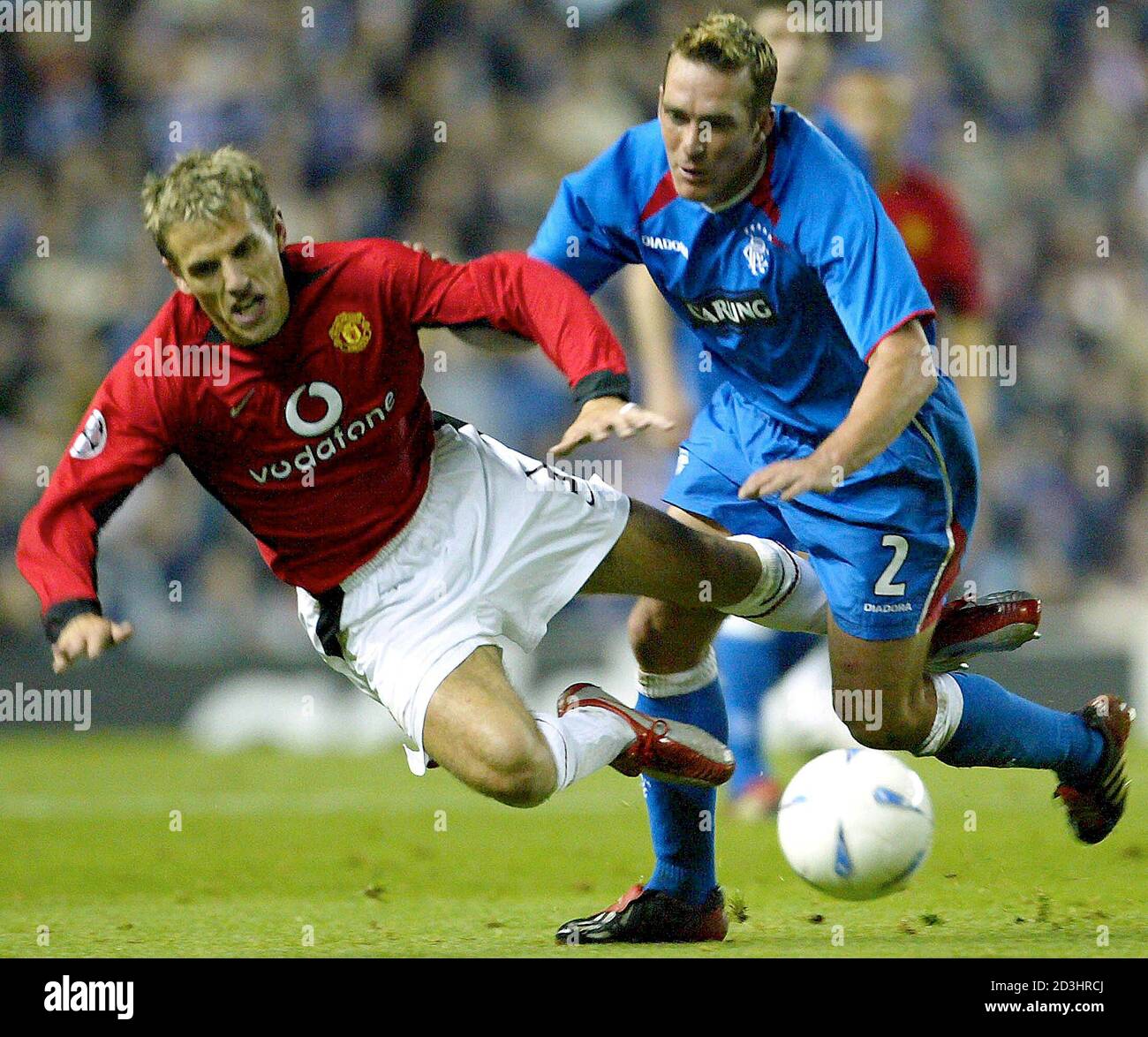 Manchester United S Philip Neville L Is Tackled By Rangers Fernando Ricksen R In The Champions League First Stage Group E Match At Ibrox Glasgow October 22 03 Manchester United Won The Match