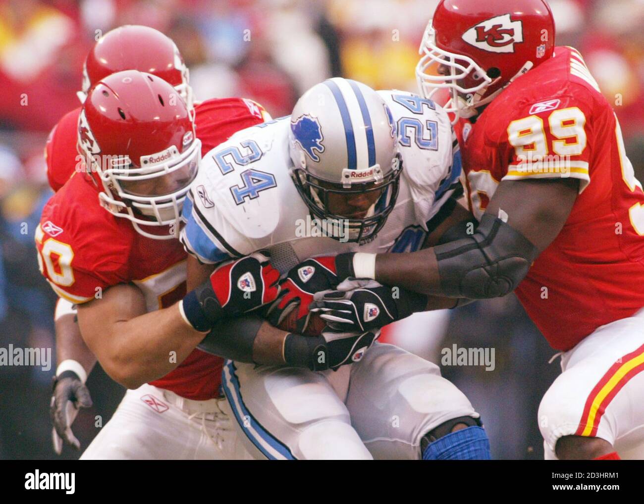 Kansas City Chiefs Defenders Kawika Mitchell 50 And Eric Hicks 99 Stop Detroit Lions Running Back Shawn Bryson 24 For A Short Gain In Kansas City December 14 03 Reuters Jeff Taylor Jat Stock Photo Alamy