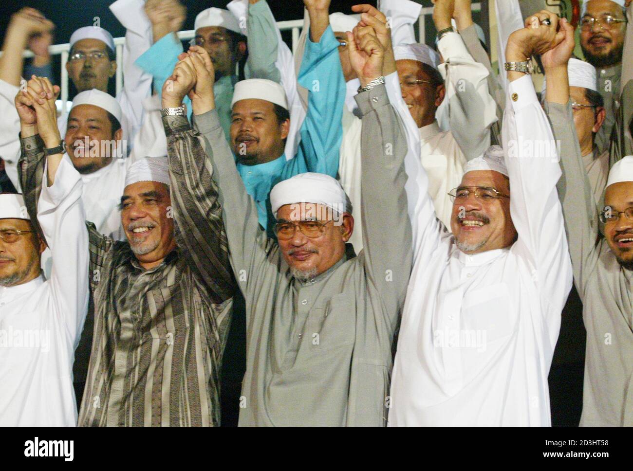 Abdul Hadi Awang President Of Malaysia S Main Opposition Parti Islam Se Malaysia Pas Bottom Row Centre Holds Hands With His Party Leaders During An Election Campaign Rally At A Stadium In Kuala Terengganu