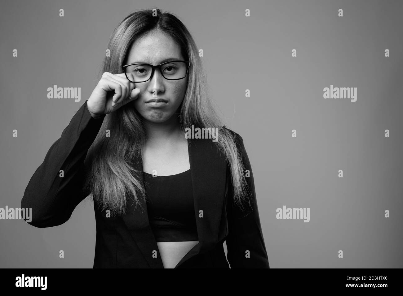 Portrait of young Asian businesswoman with eyeglasses Stock Photo