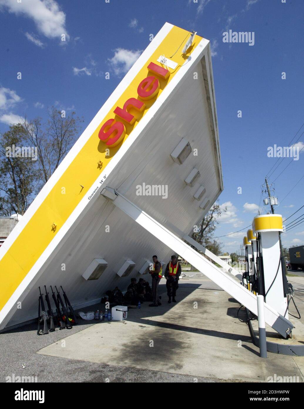 National Guardsman seek shelter from the sun at a Shell gas station