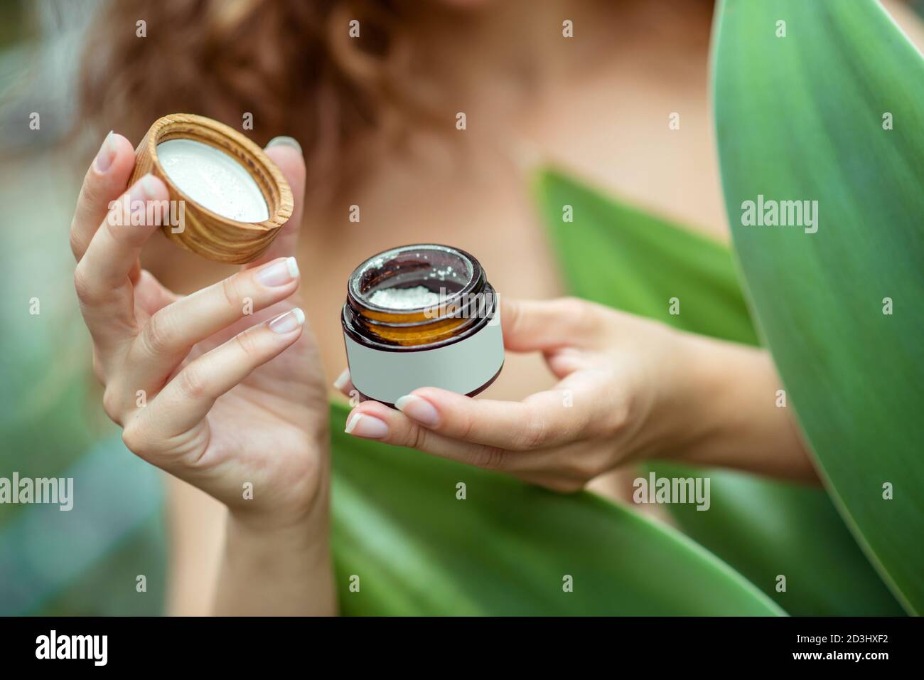 Close uo pf womans hands holding a jar of cream Stock Photo
