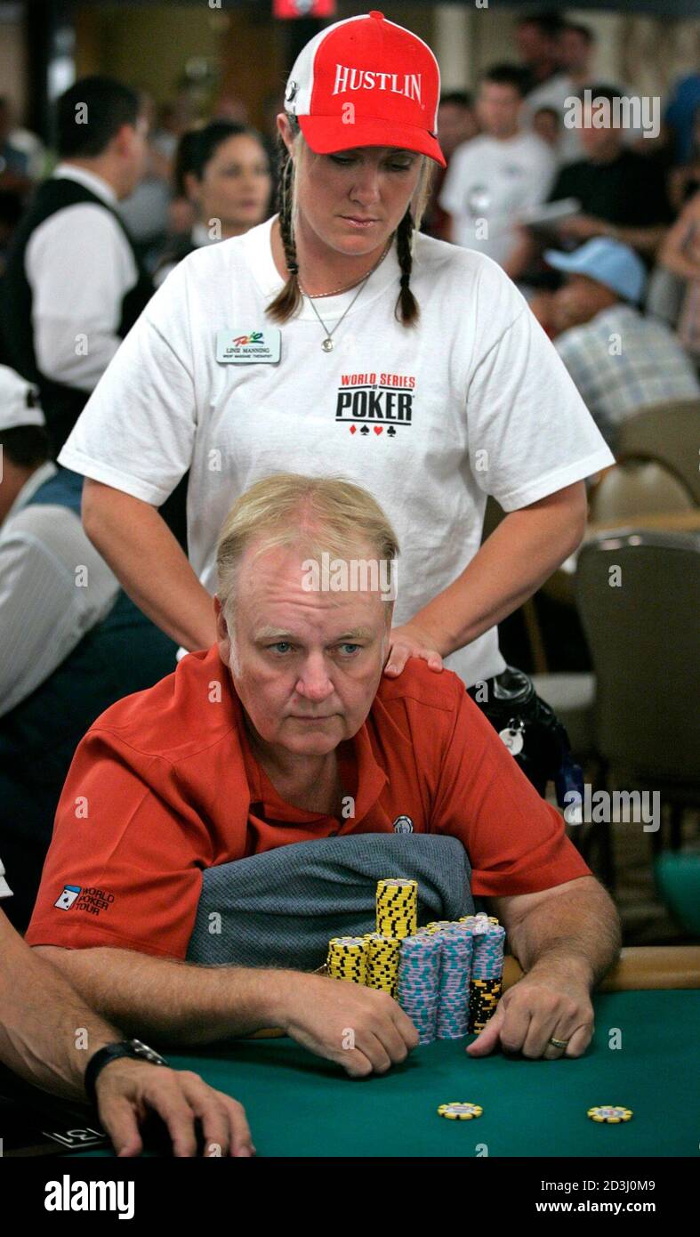 Russ Hamilton of Las Vegas receives a massage from therapist Linsi Manning  as he competes in the $10,000 buy-in, no limit Texas Hold 'Em main event  during the 36th annual World Series