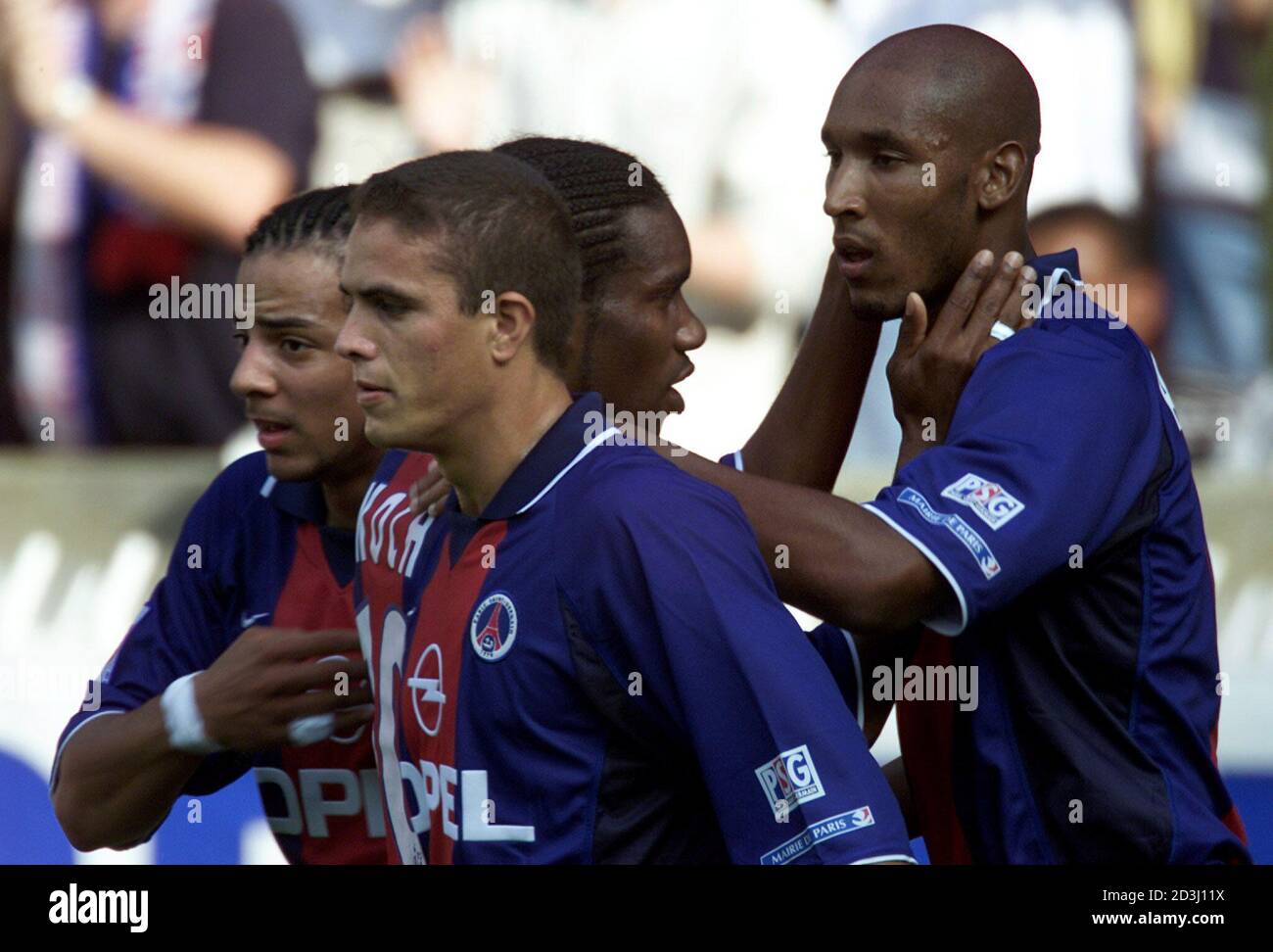 Paris Saint Germain Striker Nicolas Anelka R Is Congratulated By Jay Jay Okocha C Christian Of Brazil L And Laurent Robert After Opening The Score For His Team Against Saint Etienne In Their French First