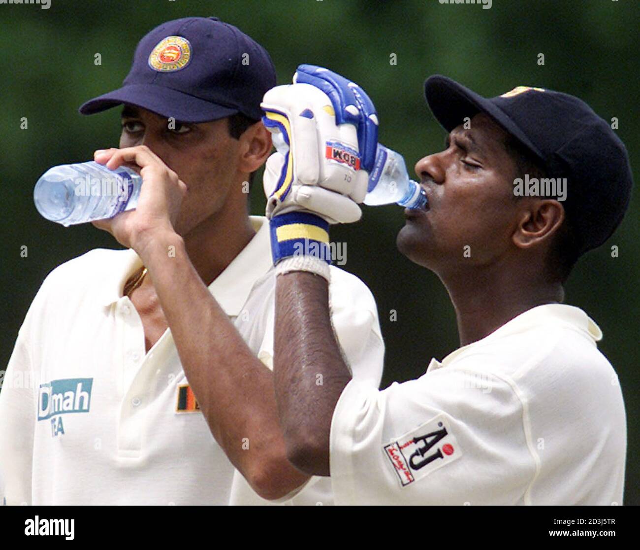 Sri Lankan batsmen Michael Vandort (L) and Naveed Nawas drink water during the third day of the second cricket test between Sri Lanka and Bangladesh at Singhalese Sports Club ground in Colombo, Sri Lanka on July 30, 2002. REUTERS/Anuruddha Lokuhapuarachchi  AL/CP Stock Photo