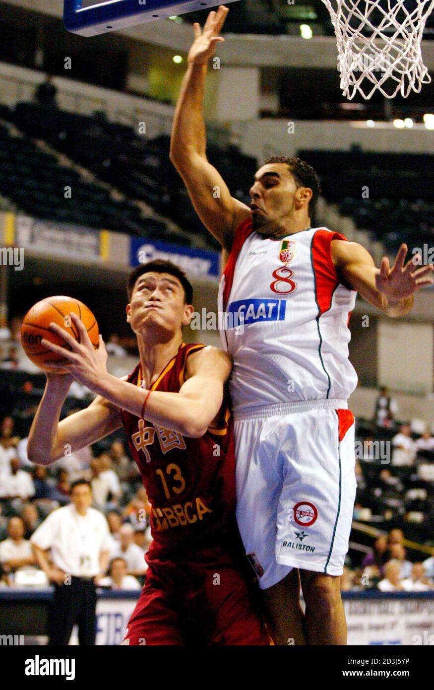 Yao Ming of China (13) fakes out defender Nabil Boudissa (8) of Algeria