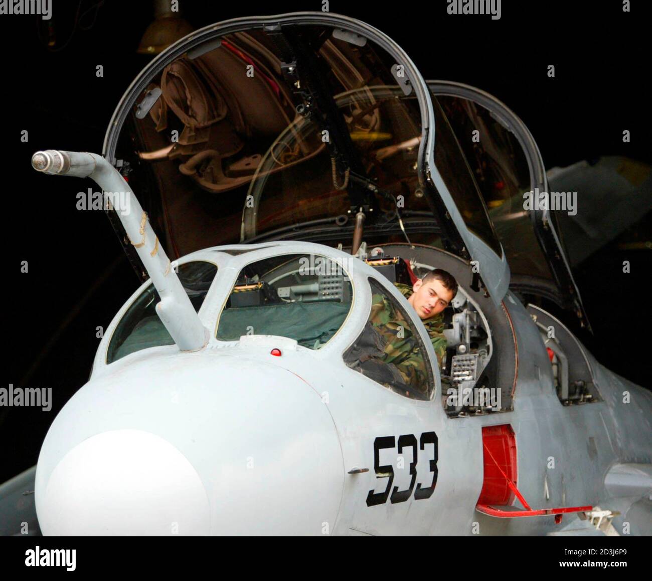 A U.S. airman checks an EA-6B Prowler radar jamming plane, used to provide an umbrella of protection over strike aircraft, during a routine check at Turkish base of Incirlik near the southern Turkish city of Adana. Christmas will be a working holiday for U.S. pilots stationed at Incirlik air base as a possible war against nearby Iraq looms on the horizon. Fighter jets from Incirlik in southern Turkey have cruised the skies above northern Iraq since a no-fly zone was imposed there after the 1991 Gulf War. Picture was taken on December 19, 2002. TO ACCOMPANY BC-IRAQ-USA-PILOTS, GENERAL FEATURE.  Stock Photo