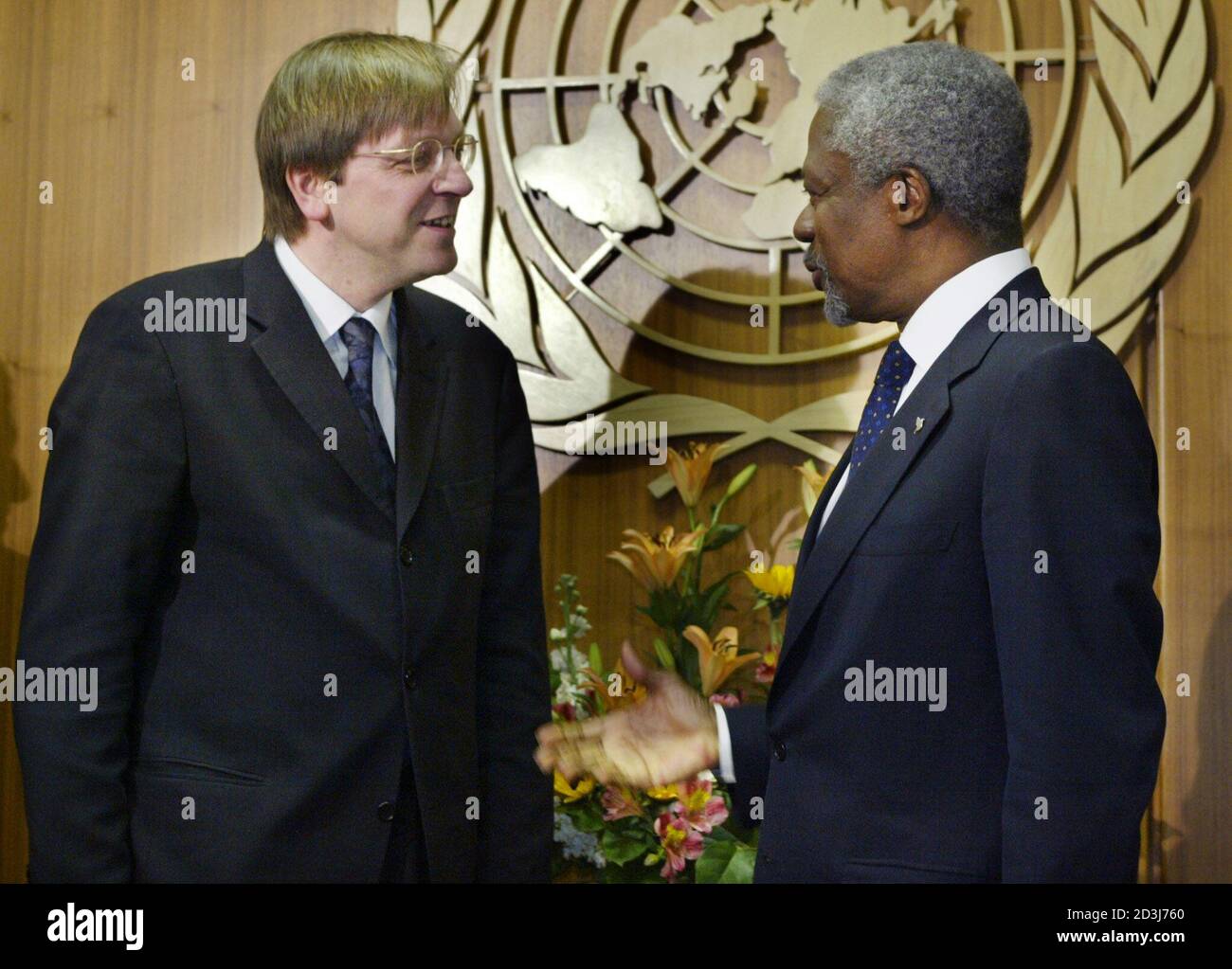 The Prime Minister of the Kingdom of Belgium, Guy Verhofstadt (L) chats with United Nations Secretary General Kofi Annan at the outset of their meeting at United Nations Headquarters in New York, February 13, 2003. REUTERS/Mike Segar  MS Stock Photo