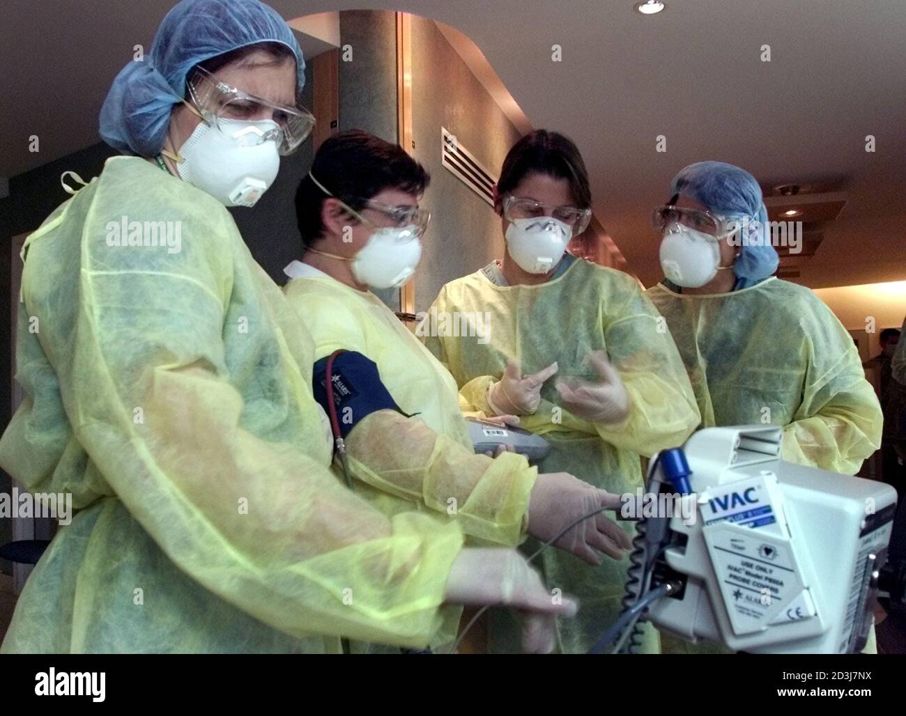 Nurses In Full Protective Clothing Check A Blood Pressure Machine Prior To Opening The Fourth Severe Acute Respiratory Syndrome Sars Assessment Clinic In Ontario At The Trillium Hospital In The West End