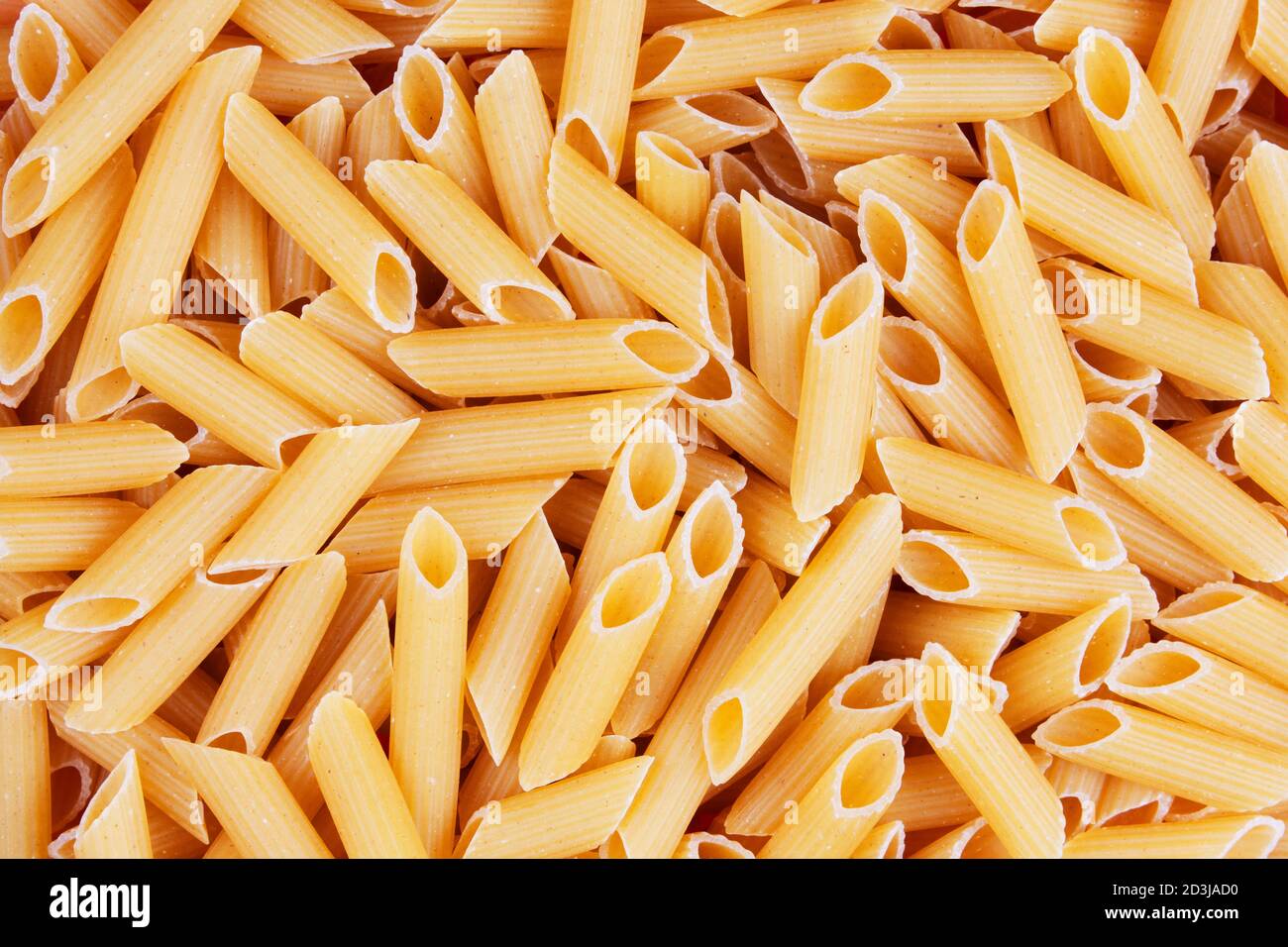 Close up of dry uncooked delicious Penne pasta with copy space Stock Photo  - Alamy