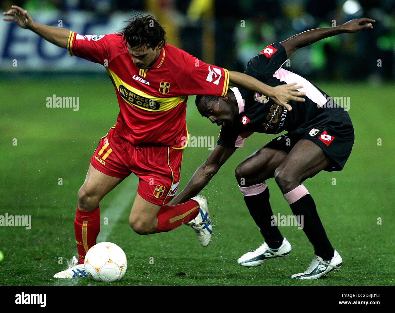 Messina's Arturo Di Napoli (L) challenges Kewullay Conteh of Palermo during their Serie A match at the San Filippo Stadium in Messina November 11, 2004. Sicily will be the centre of attention in Serie A on Thursday for the first time in nearly 40 years when Palermo and Messina, two of the three major cities on the island, meet in a local derby. Palermo, the Sicilian capital,is enjoying top flight football for the first time in 31 years while Messina's last campaign in Serie A was in 1965. REUTERS/Alessandro Bianchi  AB/ACM Stock Photo