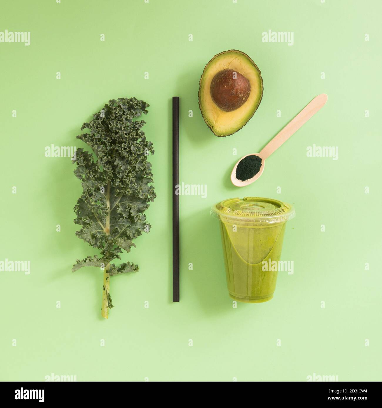 smoothie  concept, fresh Kale health food in plastic glass take away, healthy breakfast, color composition above view, still life. Stock Photo