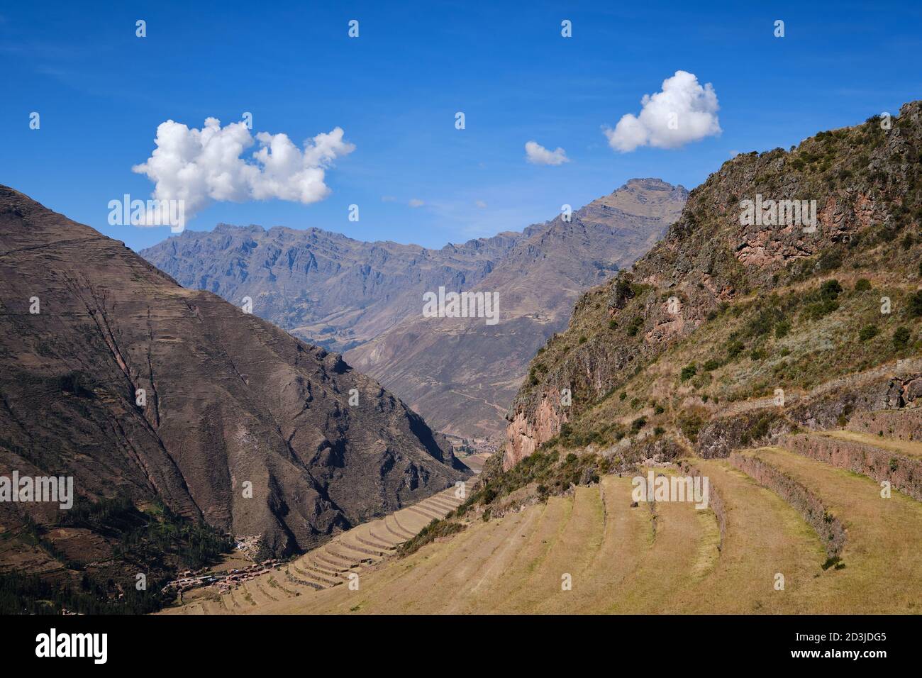 Agricultural terracing at Pisaq Pisac Incan historical site with a backdrop of Andean mountains Stock Photo