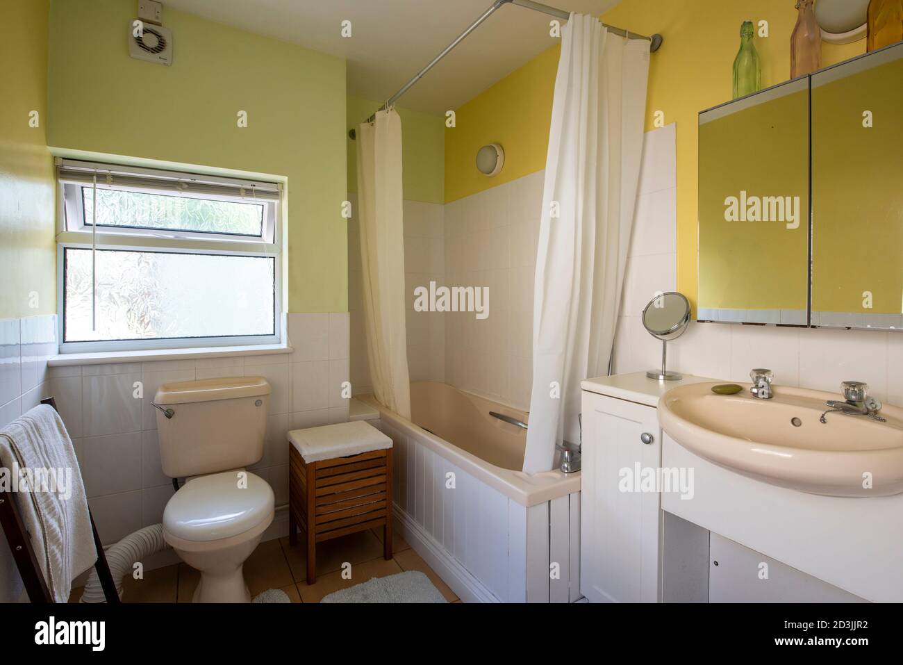 Pastel coloured bathroom in terraced house, West Midlands, UK Stock