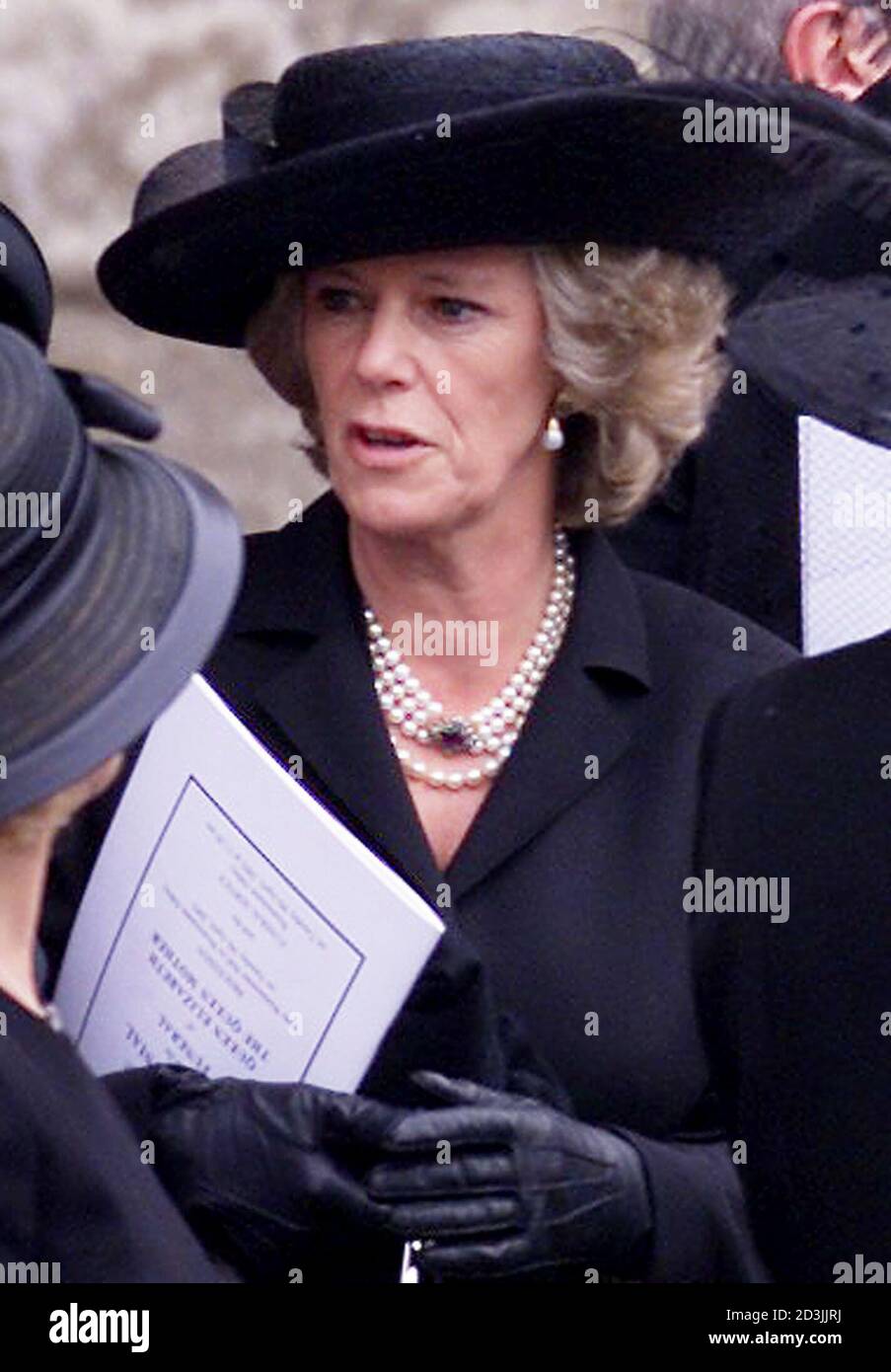 Camilla Parker-Bowles leaves London's Westminster Abbey after the funeral  of the Queen Mother, April 9, 2002. Royal dignitaries and politicians from  around the world have gathered at Westminster Abbey to pay their