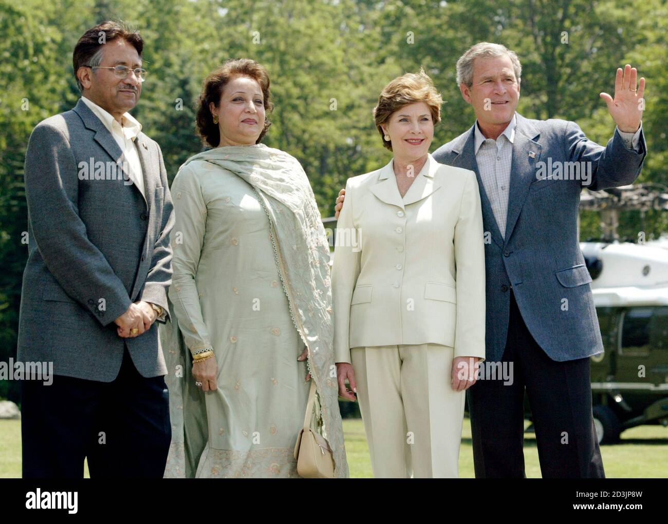 U.S. President George W. Bush and first lady Laura Bush (2nd R) pose for a  picture with Pakistan's President, General Pervez Musharraf (L) and his  wife Sehba at the end of a