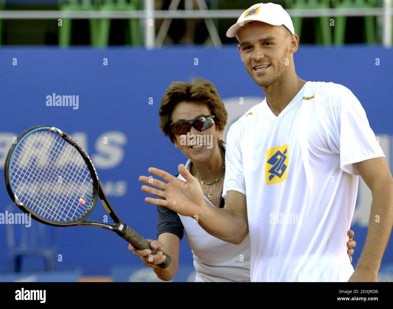 Former Brazilian tennis player Maria Ester Bueno (L) poses with compatriot  Gustavo Kuerten at Costa do Sauipe resort, in the northern coastal state of  Bahia February 27, 2004. Bueno, who won eight