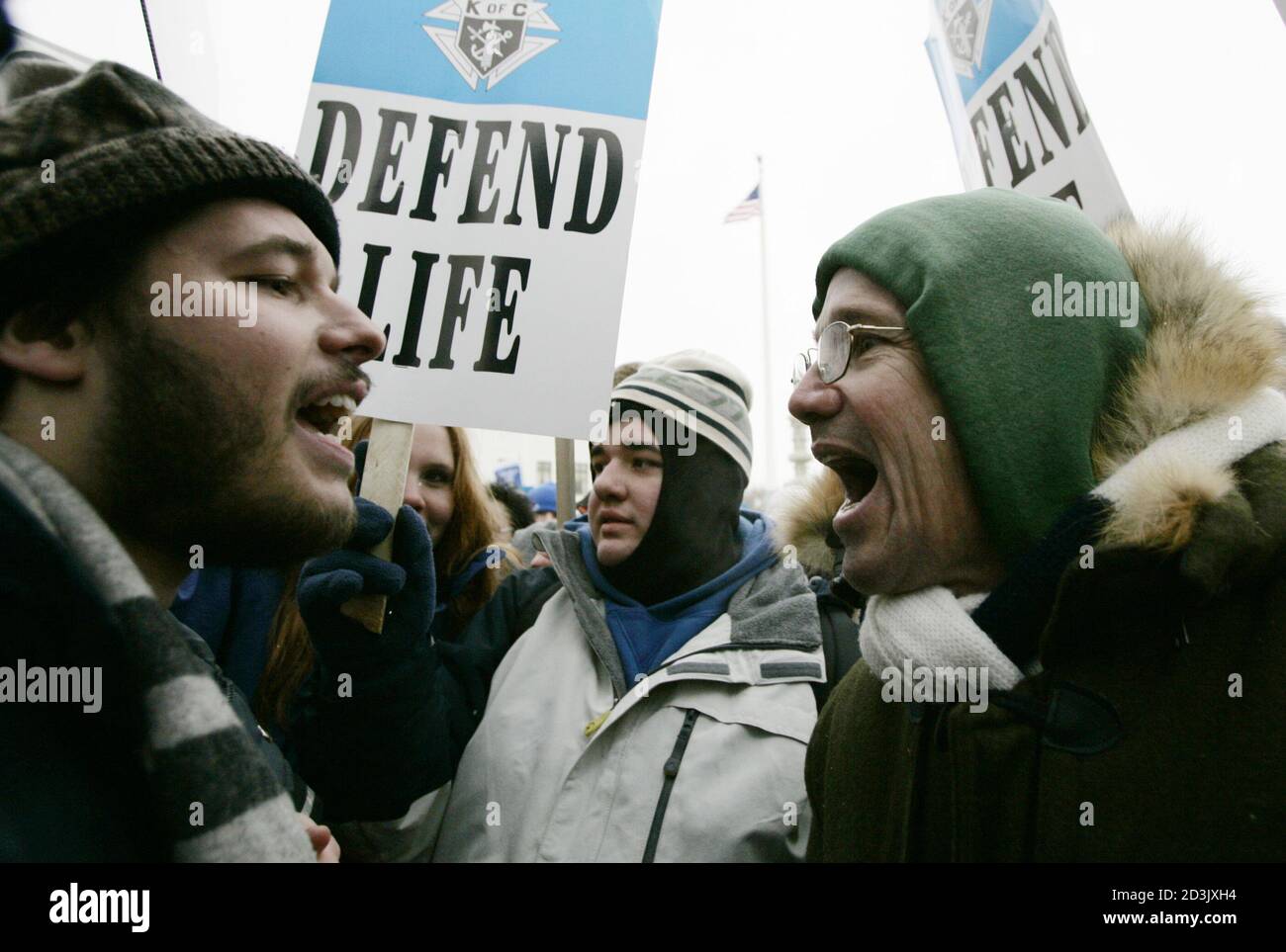 Pro-choice activist Luqman Clark of Arlington, Virginia (L) argues with an anti-Abortion protestor outside the U.S. Supreme Court, in Washington, January 24, 2005. Thousands of pro-life activists marched to the Supreme Court where they were met by a handful of pro-choice campaigners on the 32nd anniversary of the Supreme Court's decision in the Roe v. Wade abortion rights decision. REUTERS/Jason Reed  JIR/GN Stock Photo