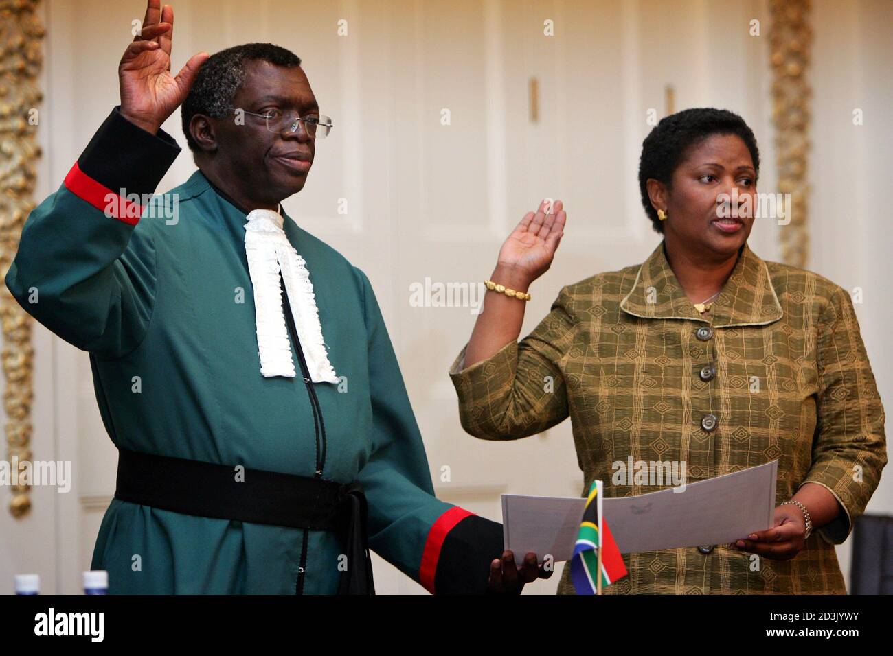 South Africa's Chief Justice Pius Langa swears in the country's new Deputy  President Phumzile Mlambo-Ngcuka in Cape Town. South Africa's Chief Justice Pius  Langa (L) swears in the country's new Deputy President