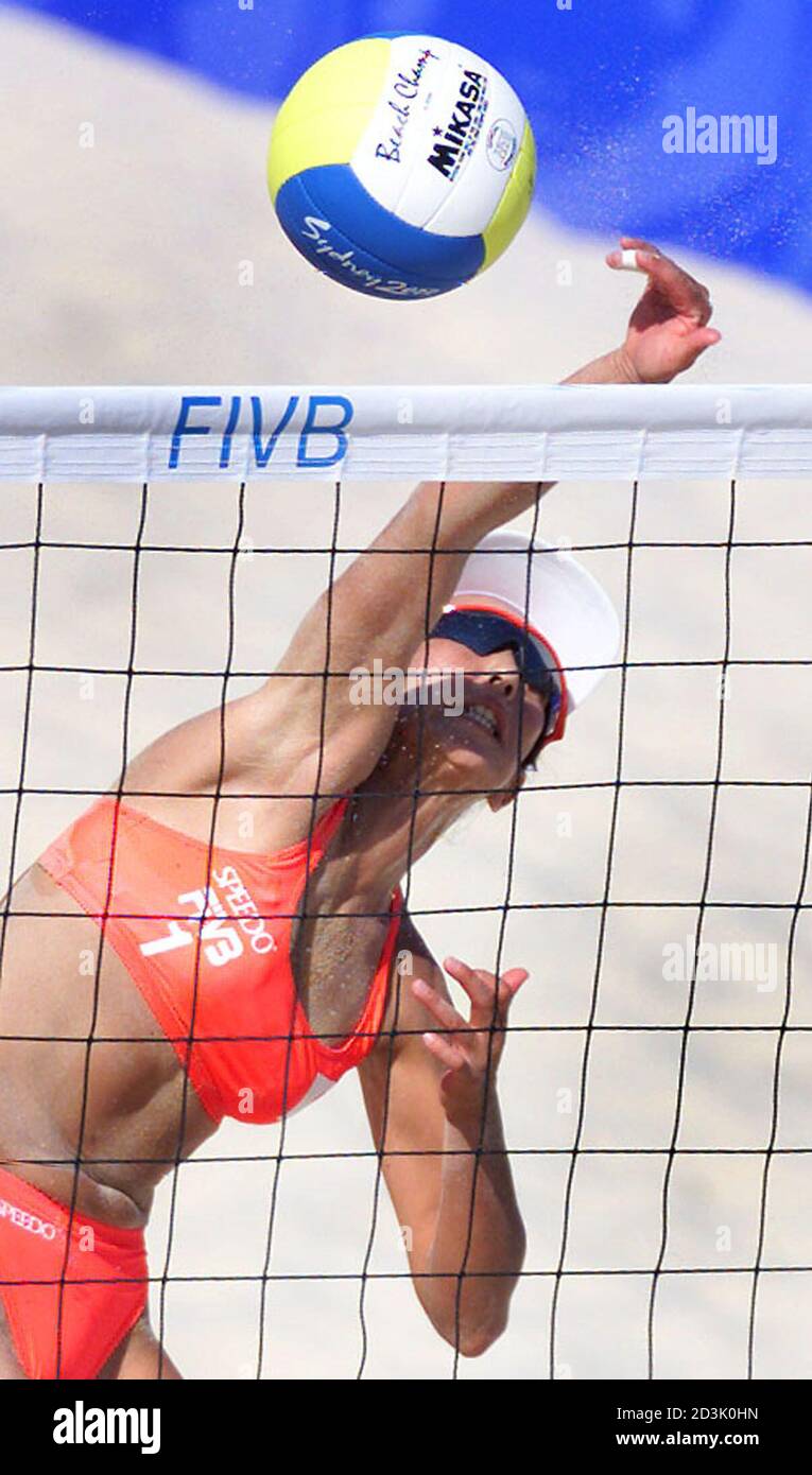 Japan's Yukiko Takahashi plays the ball over the net during their match  against Brazil in the women's beach volleyball at Bondi Beach, September  23, 2000. Brazil beat the Japanese team of Takahashi/Saiki