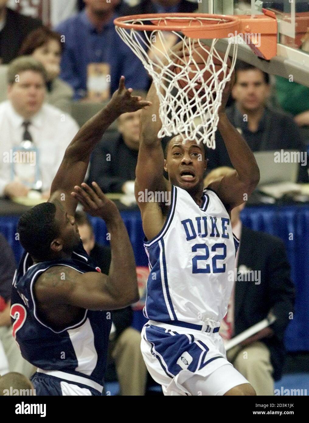 Duke Blue Devils guard Jason Williams (R) goes up for a shot ...