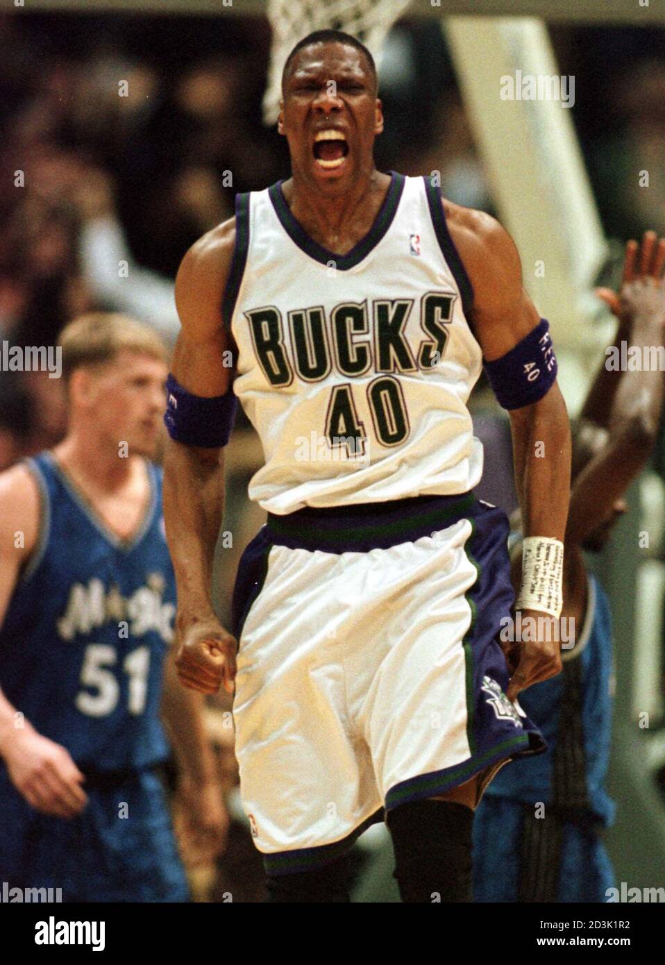 Milwaukee Bucks' center Ervin Johnson celebrates as he comes upcourt after  making a basket to put the Bucks up 98-90 over the Orlando Magic, late in  the fourth quarter, at the Bradley
