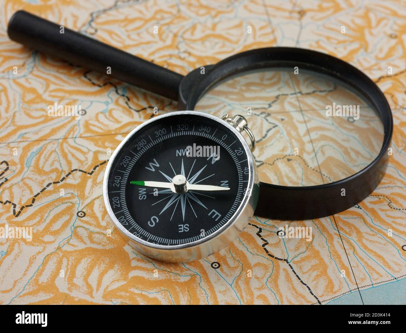 magnifying glass and compass on blank map Stock Photo Alamy