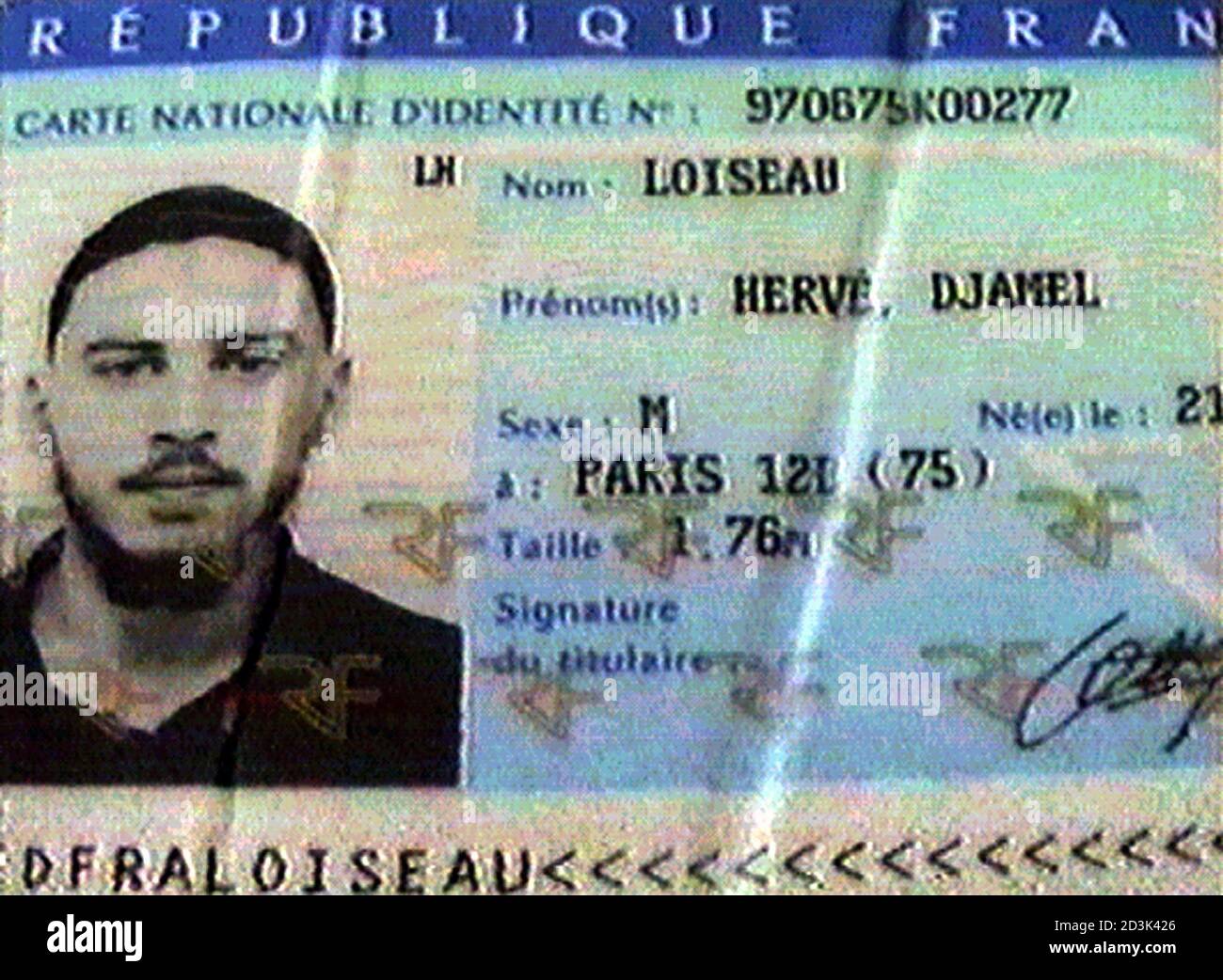VIDEO IMAGE 24DEC01 - The identity card of Herve Djamel Loiseau is pictured  in Parachinar, Pakistan on December 24, 2001. A frozen body, carrying  French documents, was found in the mountains