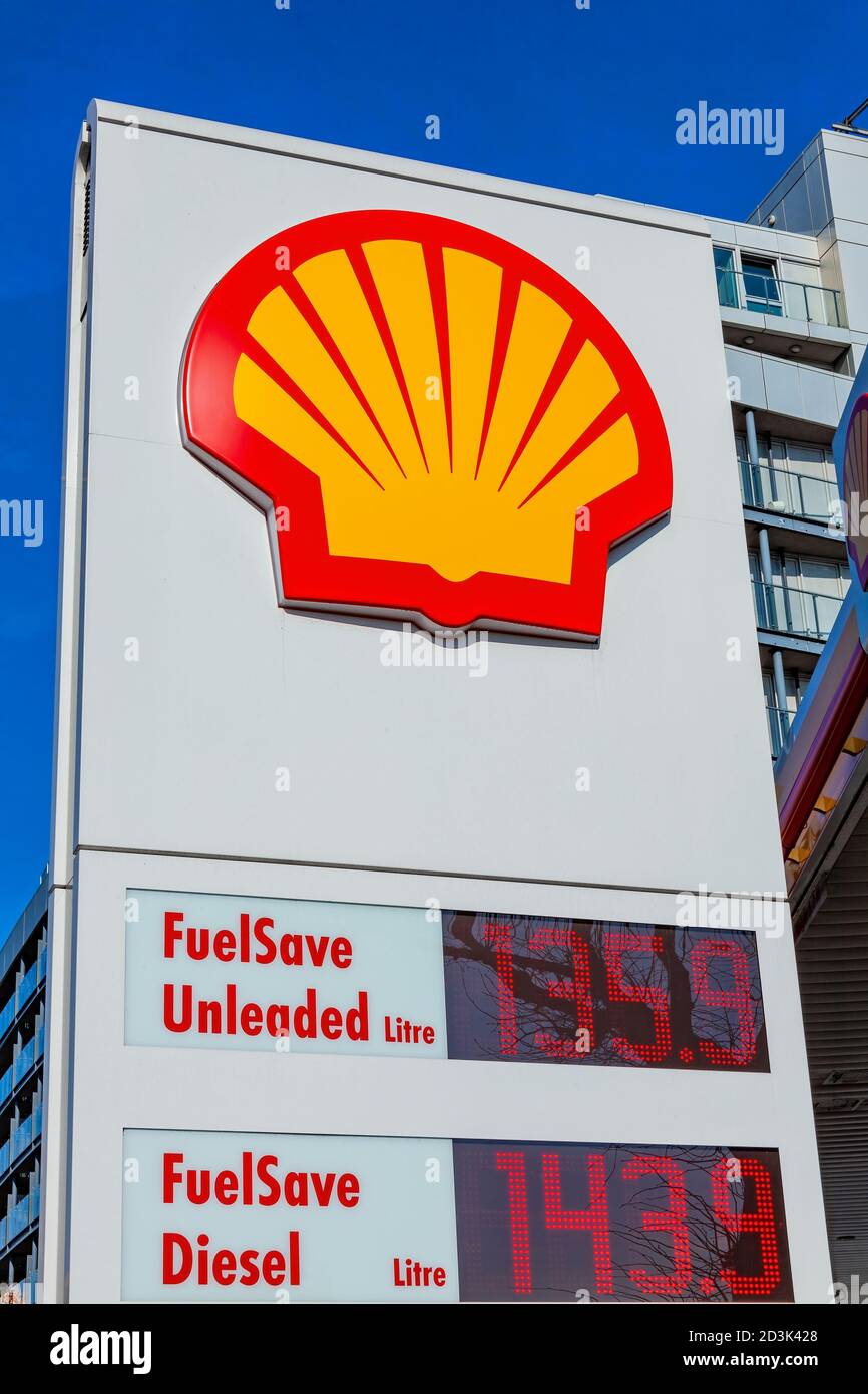 London, UK, February 26, 2012 : Shell logo advertising sign at a retail business service station garage in the city showing its petrol pump price stoc Stock Photo