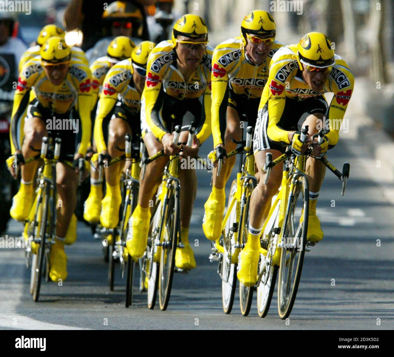 Once-Eroski team speed during the 24,6-km first stage of the Tour of Spain  cycling race September 7, 2002. Once-Eroski team and Joseba Beloki won the  stage to claim the first race leaders'