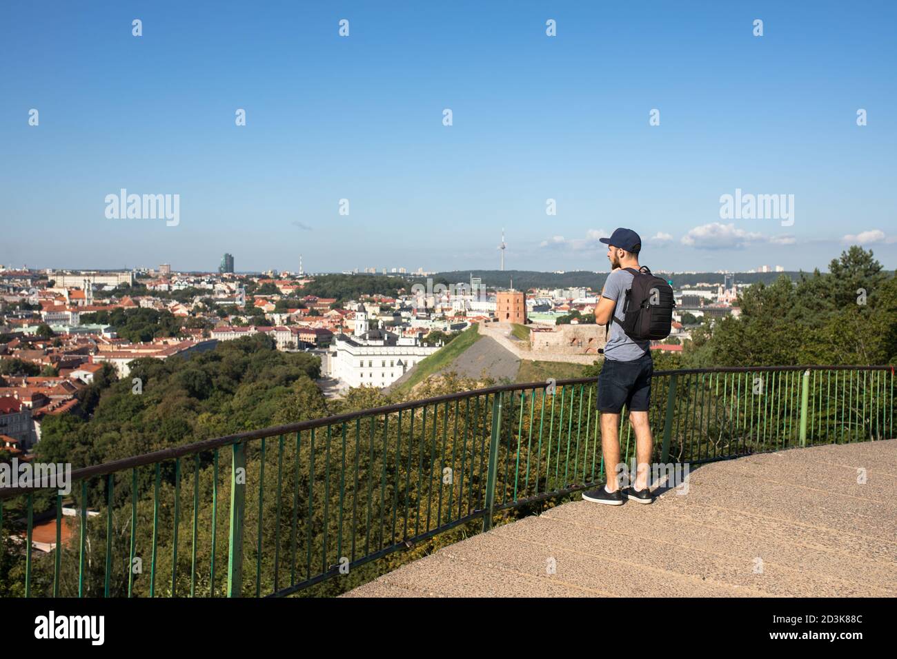 A young caucasian man traveling in Northern Europe with black camera backpack Stock Photo