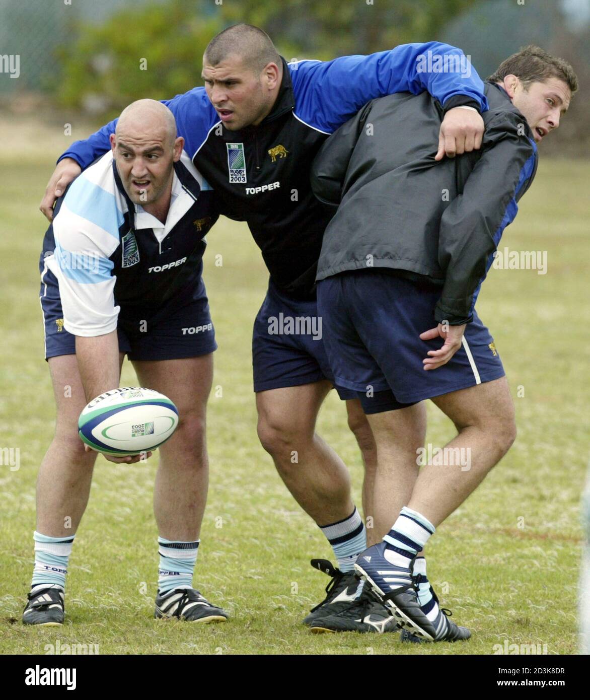 Argentine rugby players (L-R) Mario Ledesma, Martin Scelzo and Roberto Grau  train at the Randwick Army Barracks in Sydney October 3, 2003. The  Argentine team Los Pumas will face Australia October 10