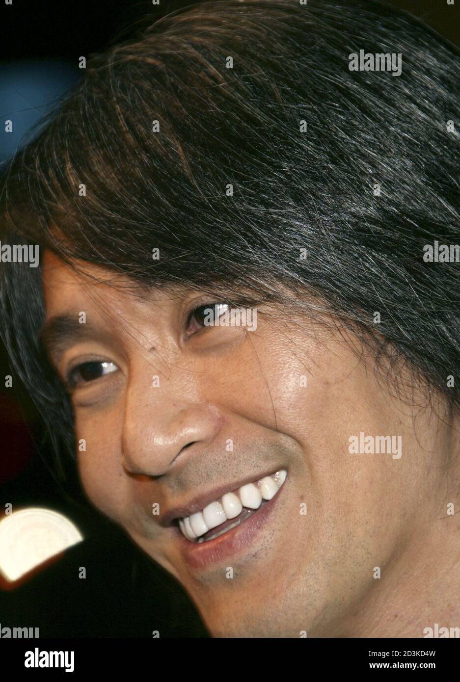 Hong Kong actor-director Stephen Chow smiles during the premiere of 'Kung Fu Hustle' at the Arclight Cinerama Dome theatre in Hollywood March 29, 2005. Stock Photo