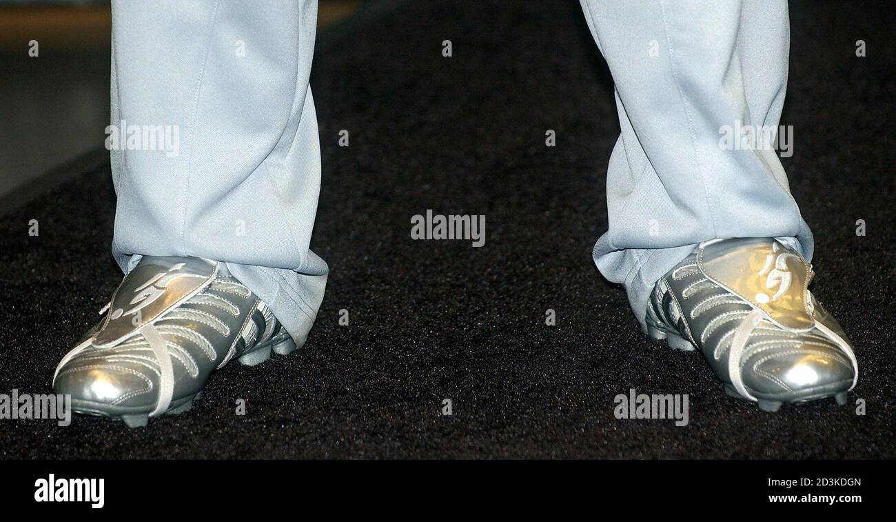 David Beckham unveils the new Adidas Predator Pulse soccer cleats during a  promotional event at the Adidas retail store in New York, June 1, 2005.  Beckham is a midfielder for the England