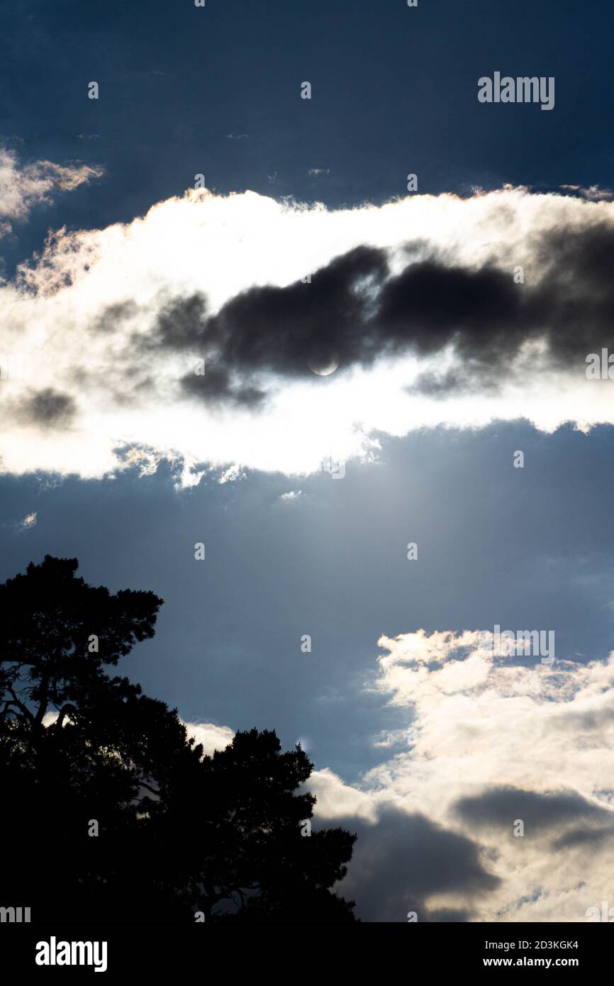 Twilight, the sun hid behind the black clouds. Stock Photo