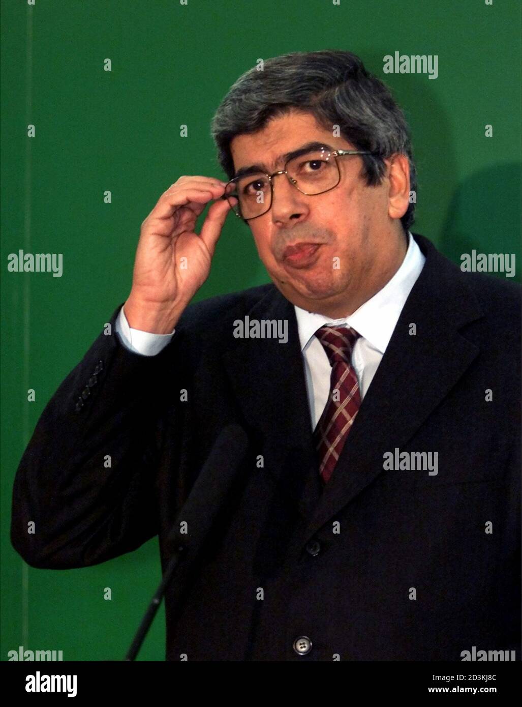 Portuguese Public Works Minister Ferro Rodrigues adjusts his glasses  announcing the candidature to the leadership of the Socialist Party  December 21, 2001. Rodrigues said he will seek a clear majority in early