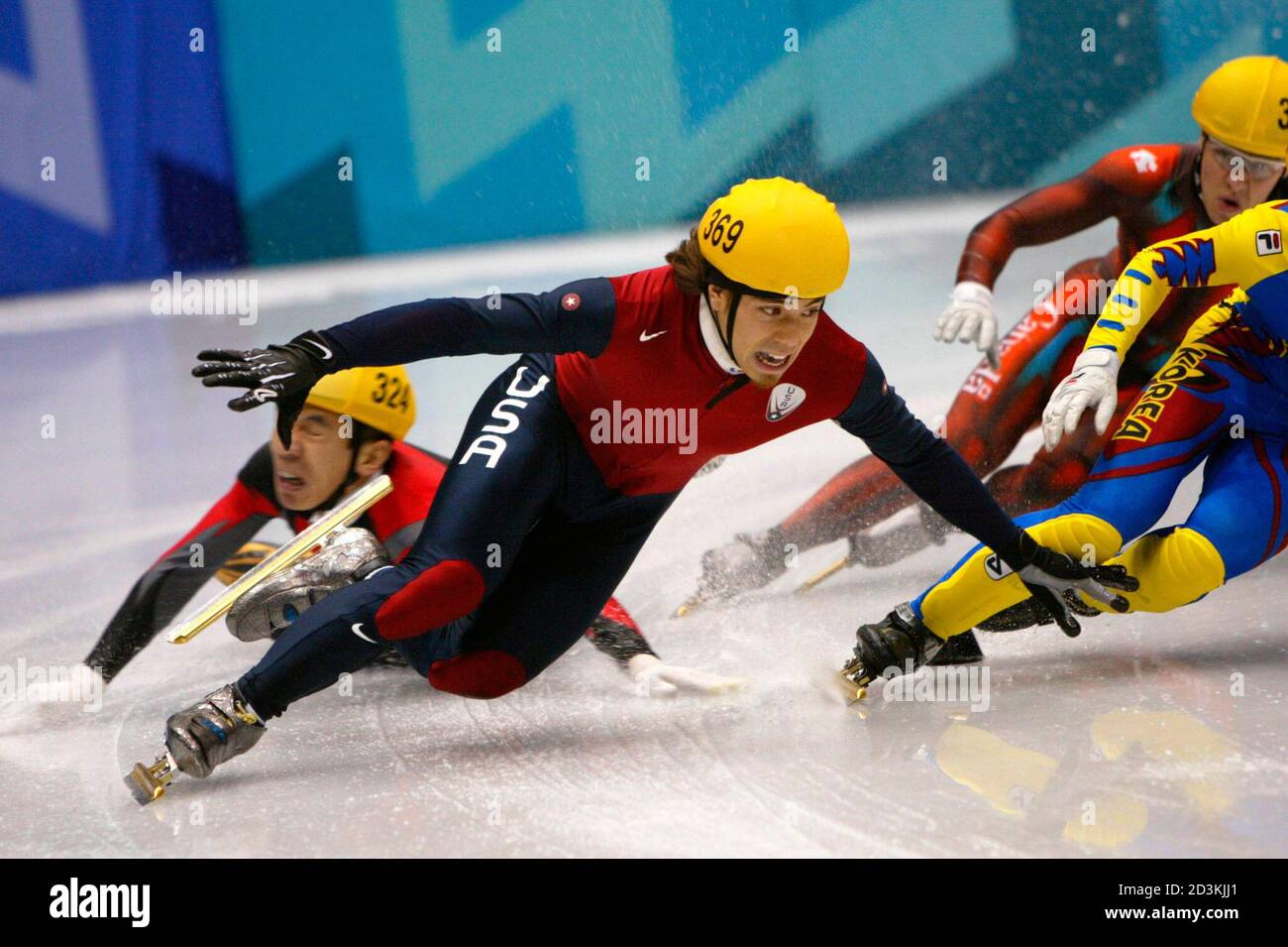 Li Jiajun (L) of China slides out of control as Apolo Anton Ohno (2nd L) of  the United States and Mathieu Turcotte of Canada skate past during the  men's 1000m short track
